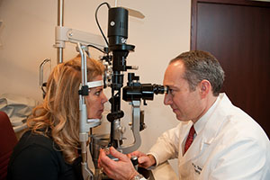 Dr. Simone performing an Eye Exam